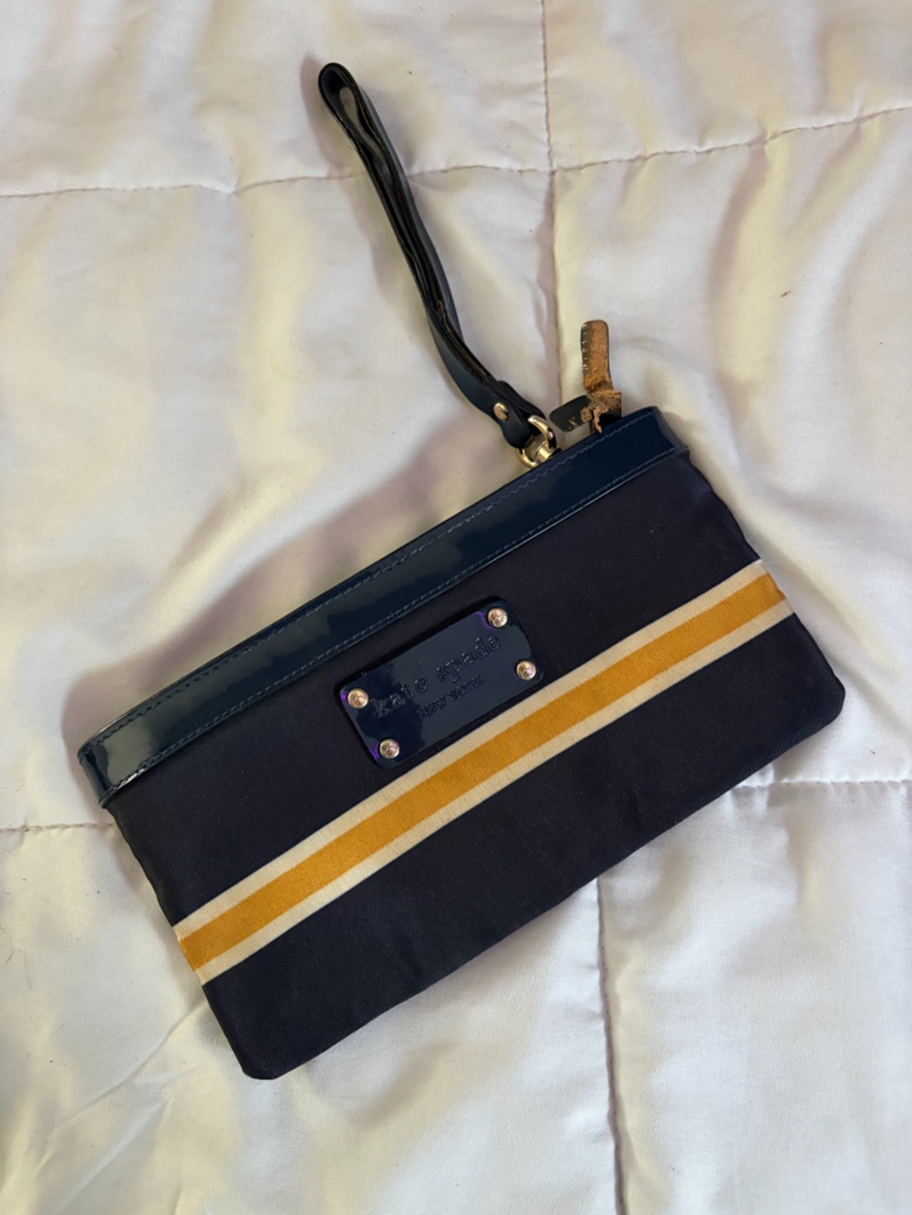 kate spade Navy Wristlet with Mustard and White Stripes